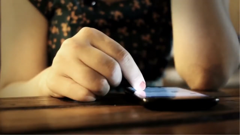 A Close-Up of A Person Using a Smartphone, Symbolizing Digital Tools Supporting Collaborative Learning