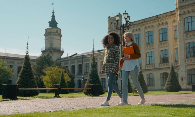 Students chatting and walking, enjoying the beautiful campus