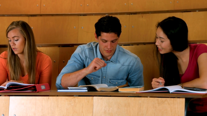 A group of students collaborates in a classroom