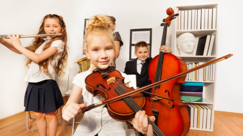 Kids playing musical instruments together during a music class
